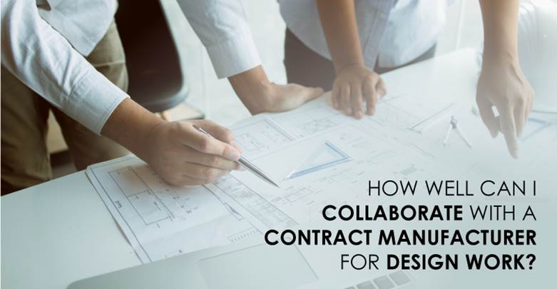 Two people collaboratively reviewing engineering drawings